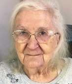 Resident Geraldine close up photo of senior woman with grey hair wearing glasses